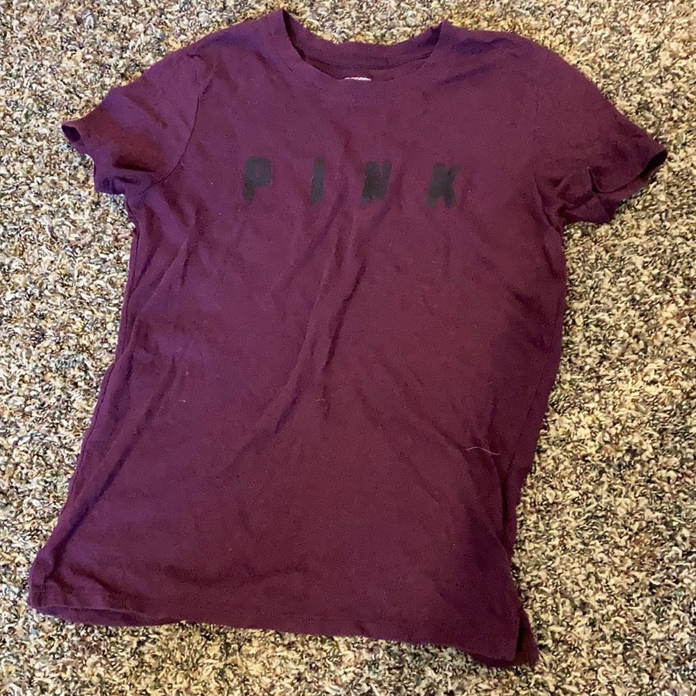 Maroon colored,pink brand t shirt, with black labeling